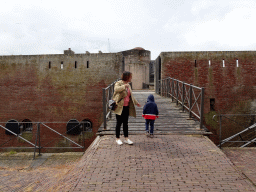 Miaomiao and Max at the entrance bridge to Fort Kijkduin