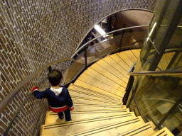 Max on the staircase from the lobby to the counter room at Fort Kijkduin