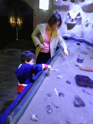 Miaomiao and Max touching fishes at the Aquarium at Fort Kijkduin