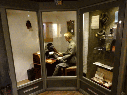 Wax statue of a soldier using a typewriter at the museum at Fort Kijkduin
