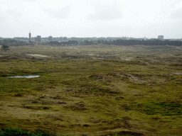 The dunes at the southeast side of Fort Kijkduin, with the tower of the Duinkerk building at the Jan Verfailleweg road