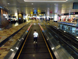 Max on the moving walkway at the Transfer Hall of Singapore Changi Airport