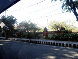 Wall at the Jalan Hayam Wuruk street, viewed from the taxi from Nusa Dua to Gianyar