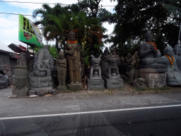 Stone sculptures at the Jalan By Pass Ngurah Rai street, viewed from the taxi from Nusa Dua to Ubud