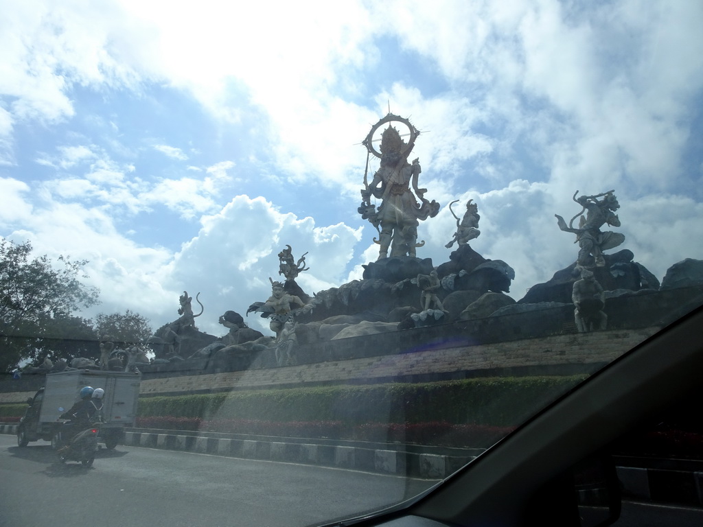The Patung Titi Banda statue at the Jalan By Pass Ngurah Rai street, viewed from the taxi from Nusa Dua to Ubud