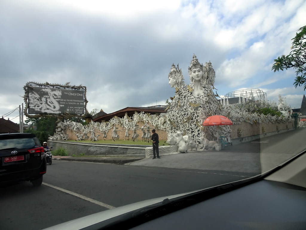 Front of the UC Silver Gold Bali sculpture shop at the Wage Rudolf Supratman street, viewed from the taxi from Nusa Dua to Ubud