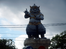 Statue at the Wage Rudolf Supratman street, viewed from the taxi from Nusa Dua to Ubud