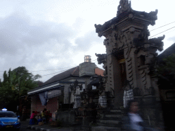 Entrance gate of a temple at the crossing of the Jalan Raya Uluwatu and Jalan Pemelisan Agung streets, viewed from the taxi from Ubud to Jimbaran