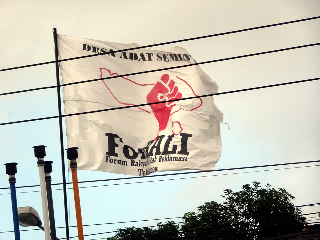 Flag of the ForBALI movement at the Jalan Sunset Road, viewed from the taxi from Nusa Dua to Beraban