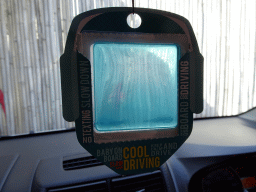 `Cool driving` accessory in the taxi at the parking place of the Upside Down World Bali