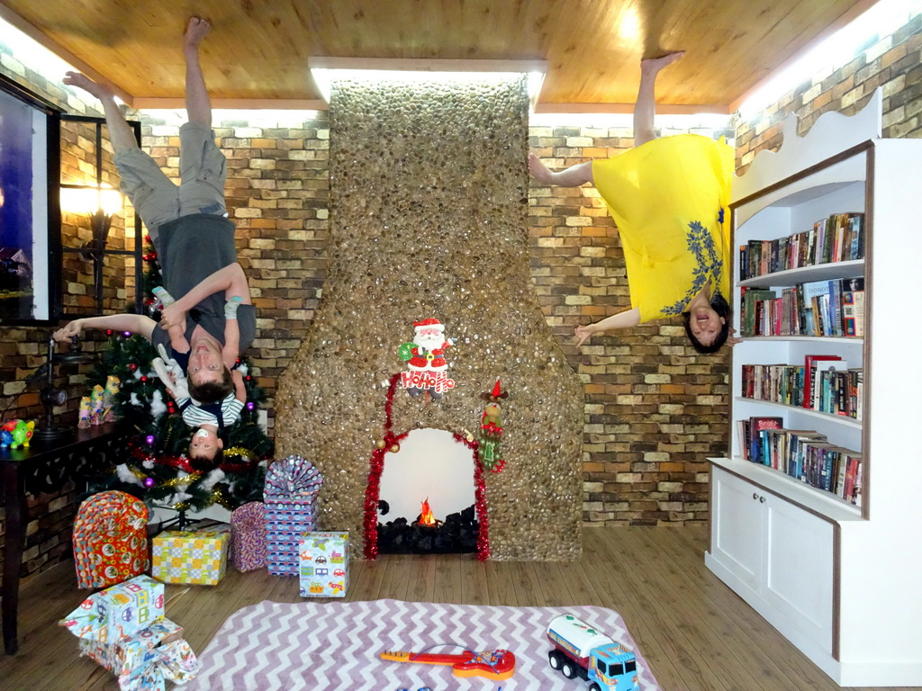 Tim, Miaomiao and Max in a living room with Christmas decorations at the Upside Down World Bali