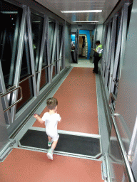 Max at the walkway to the airplane at Ngurah Rai International Airport