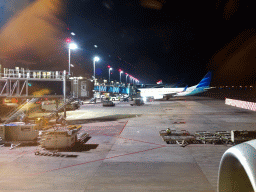 Airplanes at Ngurah Rai International Airport, viewed from our airplane, by night