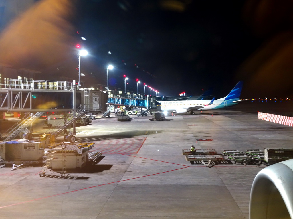 Airplanes at Ngurah Rai International Airport, viewed from our airplane, by night