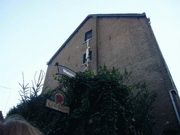 Statue hanging from a window at the Wallstreet Tea-Rose lunchroom at the Walstraat street