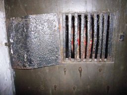 Prison window with a wax statue at the Citadel of Dinant