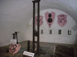 Guillotine, a tool to cut off the right hand and other torture tools at the Citadel of Dinant, with explanation