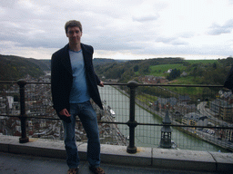Tim at the Citadel of Dinant, with a view on the city center with the tower of the Notre Dame de Dinant church and the Meuse river