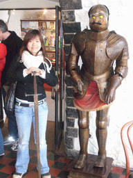 Miaomiao with a wax statue in armour at the Citadel of Dinant