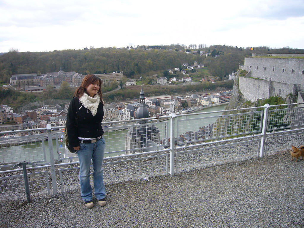 Miaomiao at the southeast part of the Citadel of Dinant, with a view on the city center with the tower of the Notre Dame de Dinant church and the Meuse river