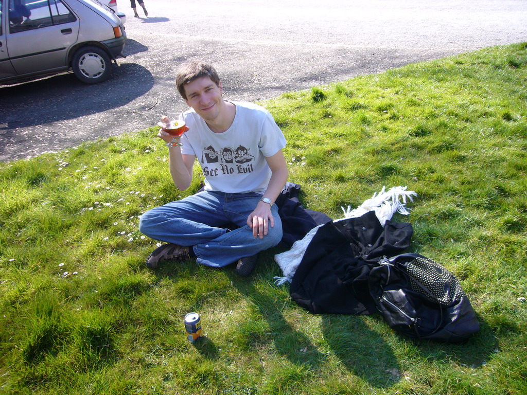 Tim having a La Merveilleuse beer on the grass in front of the La Merveilleuse caves