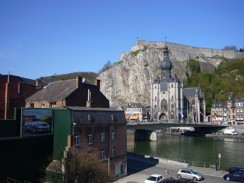 The city center with the Notre Dame de Dinant church, the Citadel of Dinant and the Pont Charles de Gaulle bridge over the Meuse river, viewed from the Rue Francoise Bribosia street