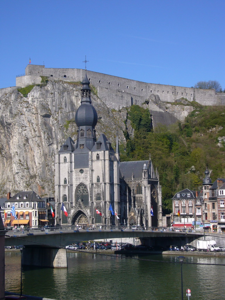 The city center with the Notre Dame de Dinant church, the Citadel of Dinant and the Pont Charles de Gaulle bridge over the Meuse river, viewed from the Rue Francoise Bribosia street