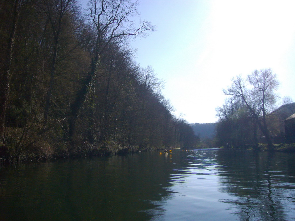 Canoes on the Meuse river, viewed from the tour boat