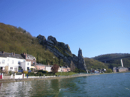 The Rocher Bayard rock and the Route Charlemagne road over the Meuse river, viewed from the tour boat