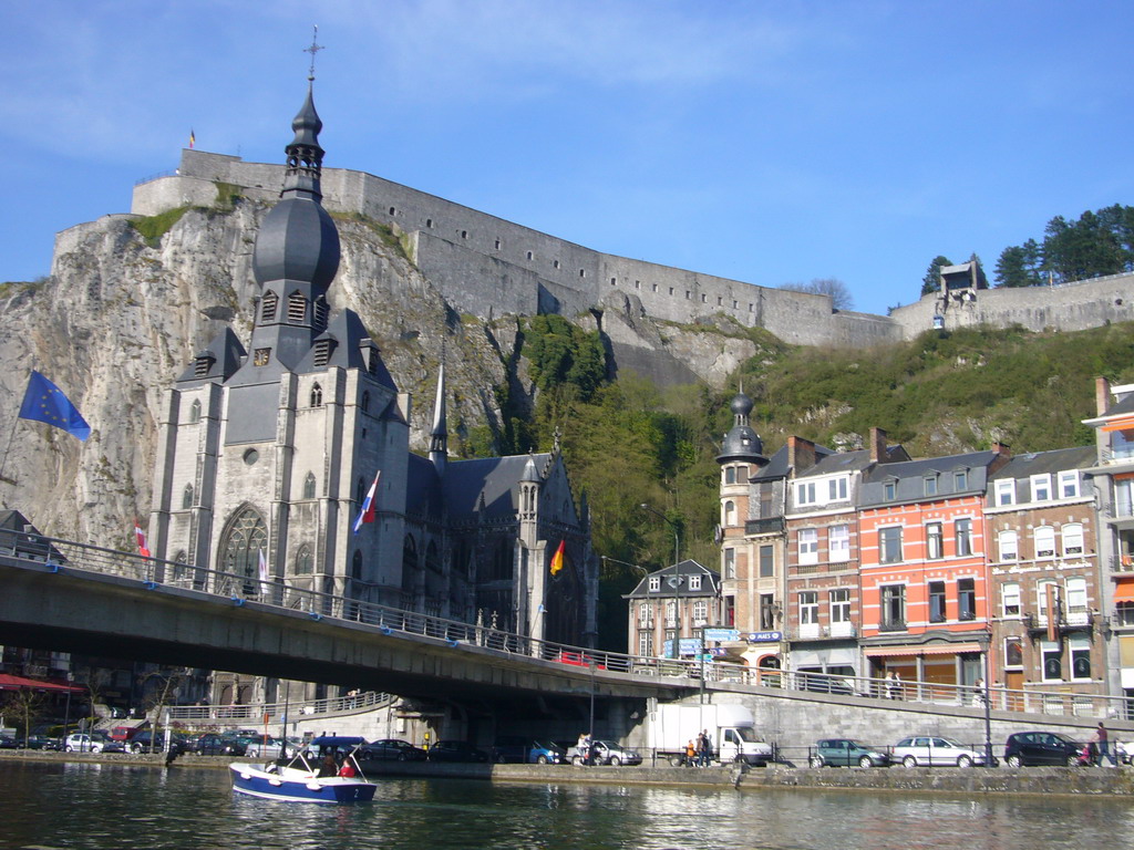 The city center with the Notre Dame de Dinant church, the Citadel of Dinant and the Pont Charles de Gaulle bridge over the Meuse river, viewed from the tour boat