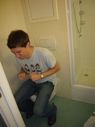 Tim on the toilet of our room at the Hotel Ibis Dinant