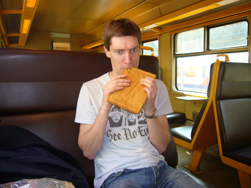 Tim with a saxophone cook from Patisserie Jacobs in the train to Namur