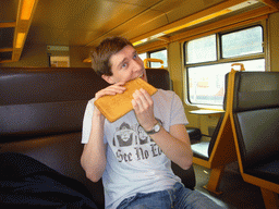 Tim with a saxophone cook from Patisserie Jacobs in the train to Namur