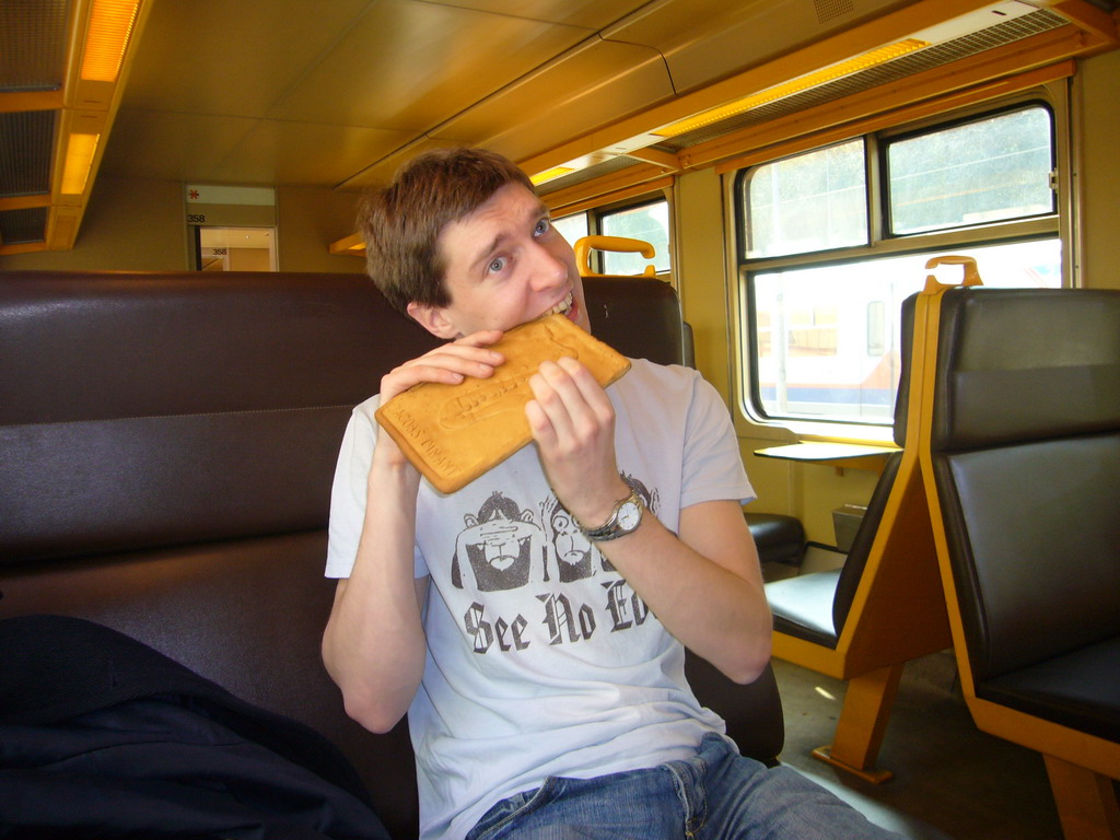 Tim with a saxophone cook from Patisserie Jacobs in the train to Namur