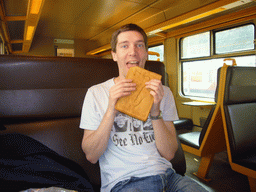 Tim with a saxophone cook from Patisserie Jacobs in the train to Namur