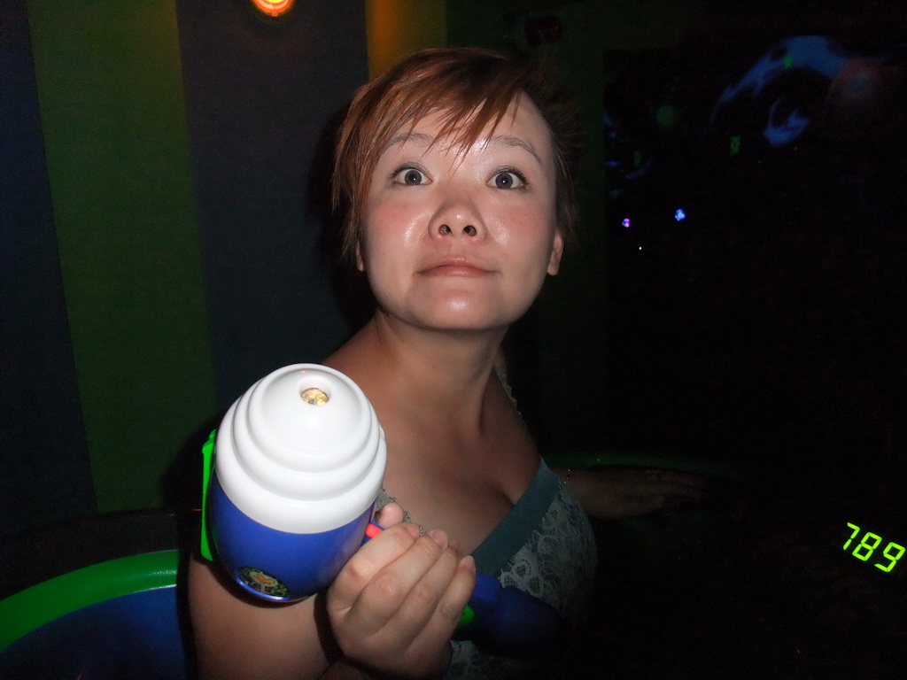 Miaomiao with laser gun in Buzz Lightyear Laser Blast, at Discoveryland of Disneyland Park