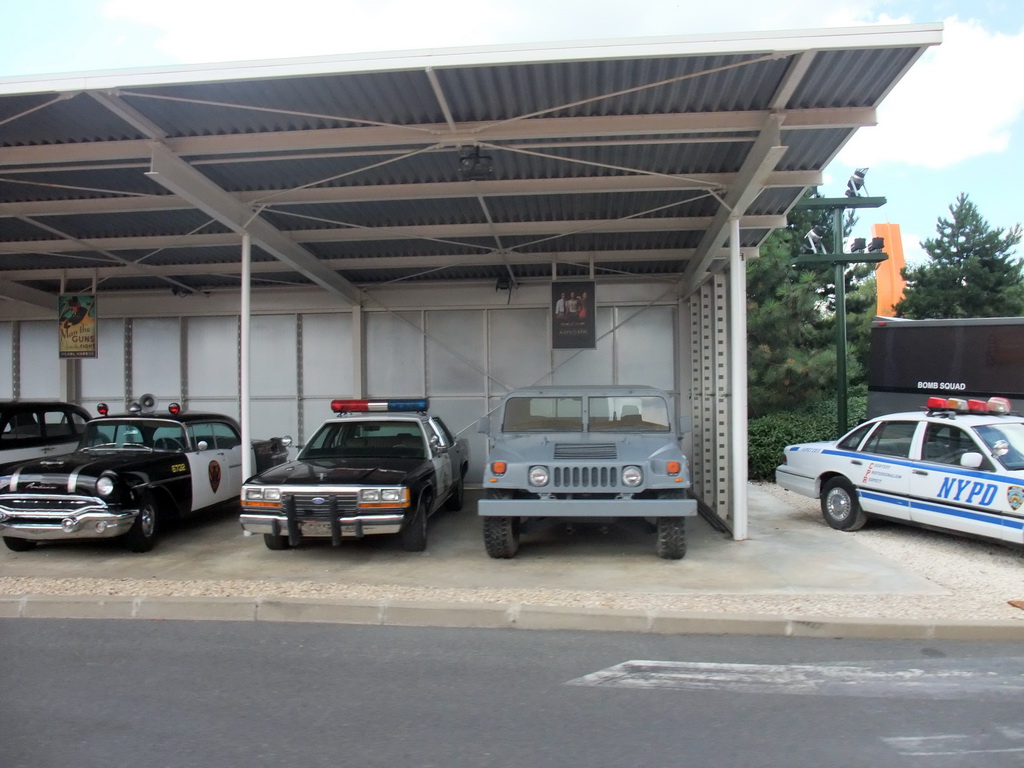 Old cars from the movies `Pearl Harbor` and `Con Air`, and an NYPD car, at the Studio Tram Tour: Behind the Magic, at the Production Courtyard of Walt Disney Studios Park