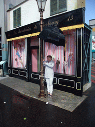 Miaomiao under an umbrella from the movie `The Umbrellas of Cherbourg`, at the Backlot of Walt Disney Studios Park