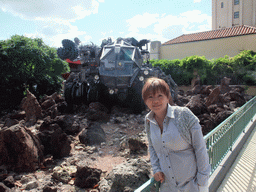 Miaomiao at a vehicle from the movie `Armageddon`, in front of `Armageddon: Les Effets Speciaux`, at the Backlot of Walt Disney Studios Park