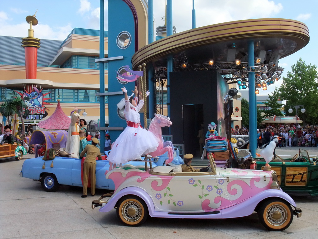 Daisy, Mary Poppins, Aladdin and Princess Jasmine in Disney`s Stars `n` Cars parade, at the Production Courtyard of Walt Disney Studios Park