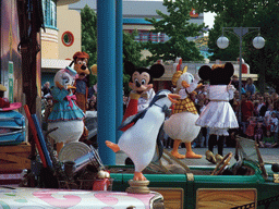 Daisy, Goofy, Mickey, Donald and Minnie in Disney`s Stars `n` Cars parade, at the Production Courtyard of Walt Disney Studios Park