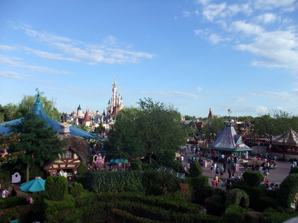 Mad Hatter`s Tea Cups and Sleeping Beauty`s Castle, viewed from the Tower in Alice`s Curious Labyrinth, at Fantasyland of Disneyland Park