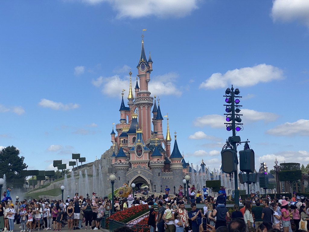 Pluto at the Disney Stars on Parade at Central Plaza and Sleeping Beauty`s Castle at Fantasyland at Disneyland Park