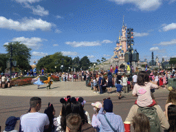 Jessey, Woody, the Genie, Cinderella, the Mad Hatter, Joy and Pluto at the Disney Stars on Parade at Central Plaza and Sleeping Beauty`s Castle at Fantasyland at Disneyland Park