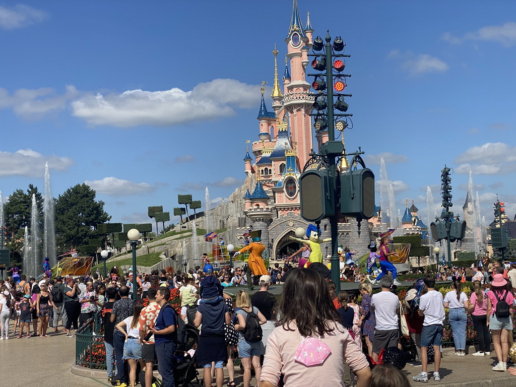 Miguel, the Mad Hatter, Joy, Donald, Daisy and Mickey at the Disney Stars on Parade at Central Plaza and Sleeping Beauty`s Castle at Fantasyland at Disneyland Park