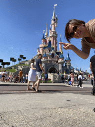 Miaomiao at Central Plaza with the front of Sleeping Beauty`s Castle at Fantasyland at Disneyland Park