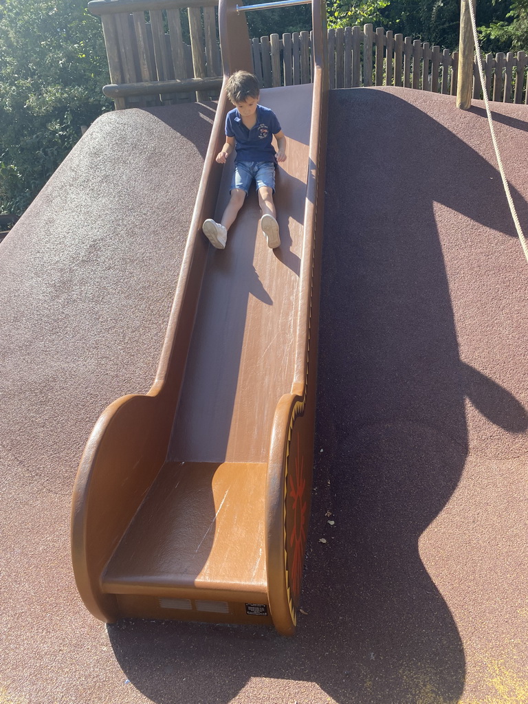 Max on a slide at the Frontierland Playground at Frontierland at Disneyland Park