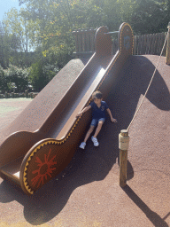 Max on a slide at the Frontierland Playground at Frontierland at Disneyland Park