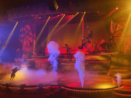 Actors, musicians, acrobats and smoke on the stage of the Frontierland Theatre at Frontierland at Disneyland Park, during the Lion King: Rhythms of the Pride Lands show