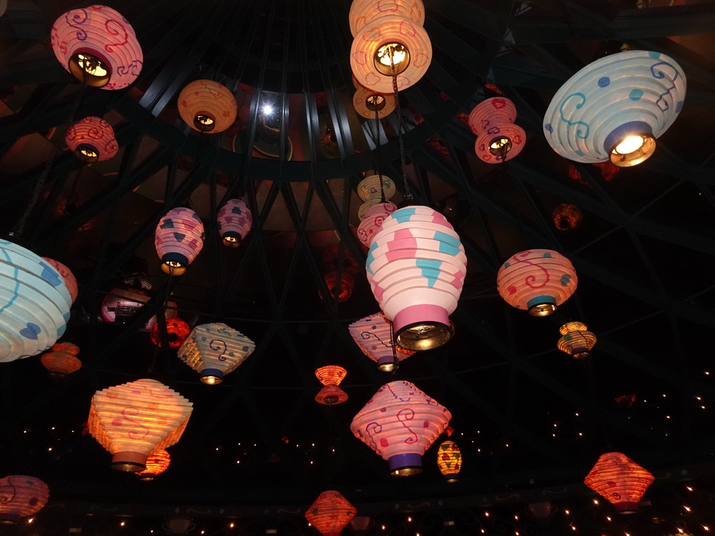 Paper lanterns on the ceiling of the Mad Hatter`s Tea Cups attraction at Fantasyland at Disneyland Park, by night
